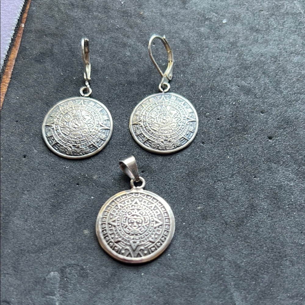 Sterling silver quarter size earrings and pendent Detailing Mexican almanac.